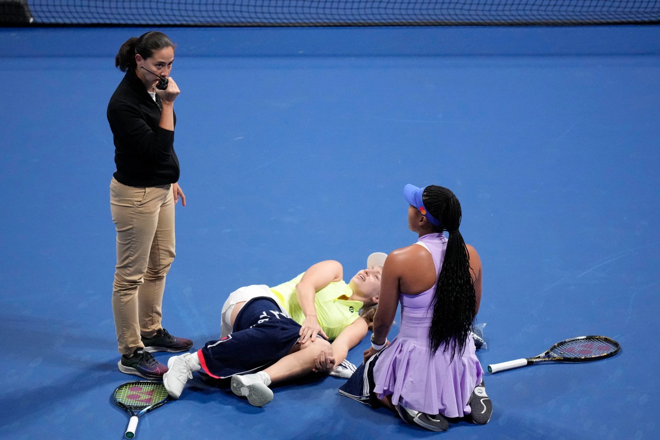 Australian Daria Saville lies in pain before retiring in her match against Naomi Osaka n Tokyo.