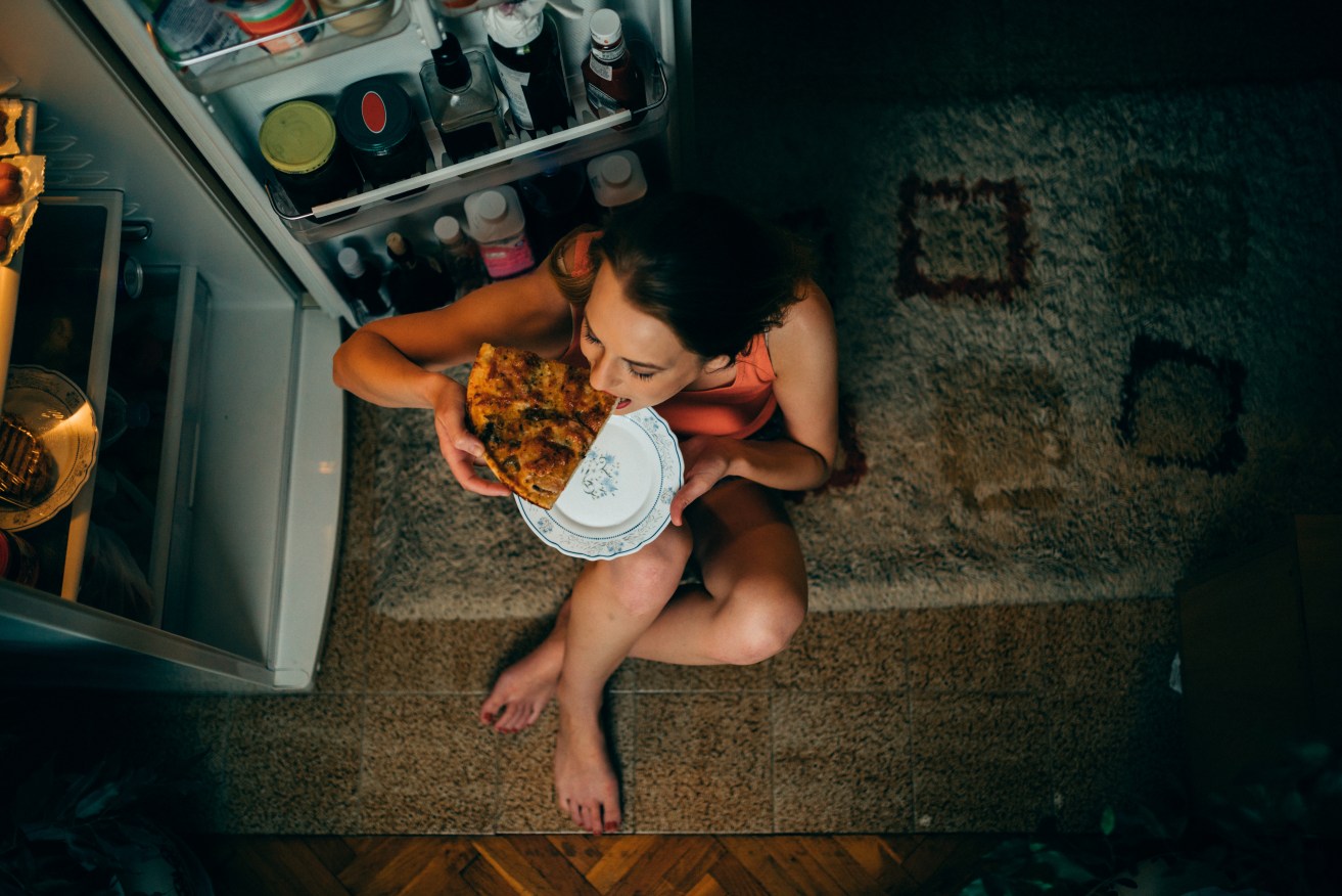 Sneaking a late-night snack makes you hungry, and burns calories at a slower rate. Photo: Getty  