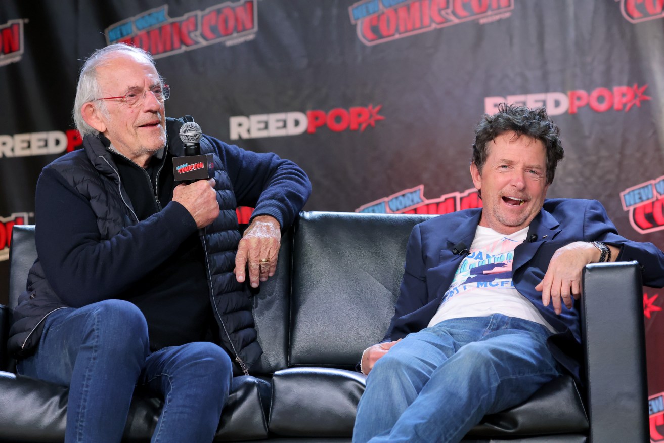 Michael J Fox and Christopher Lloyd attend a <i>Back to The Future Reunion</i> panel at New York Comic Con.