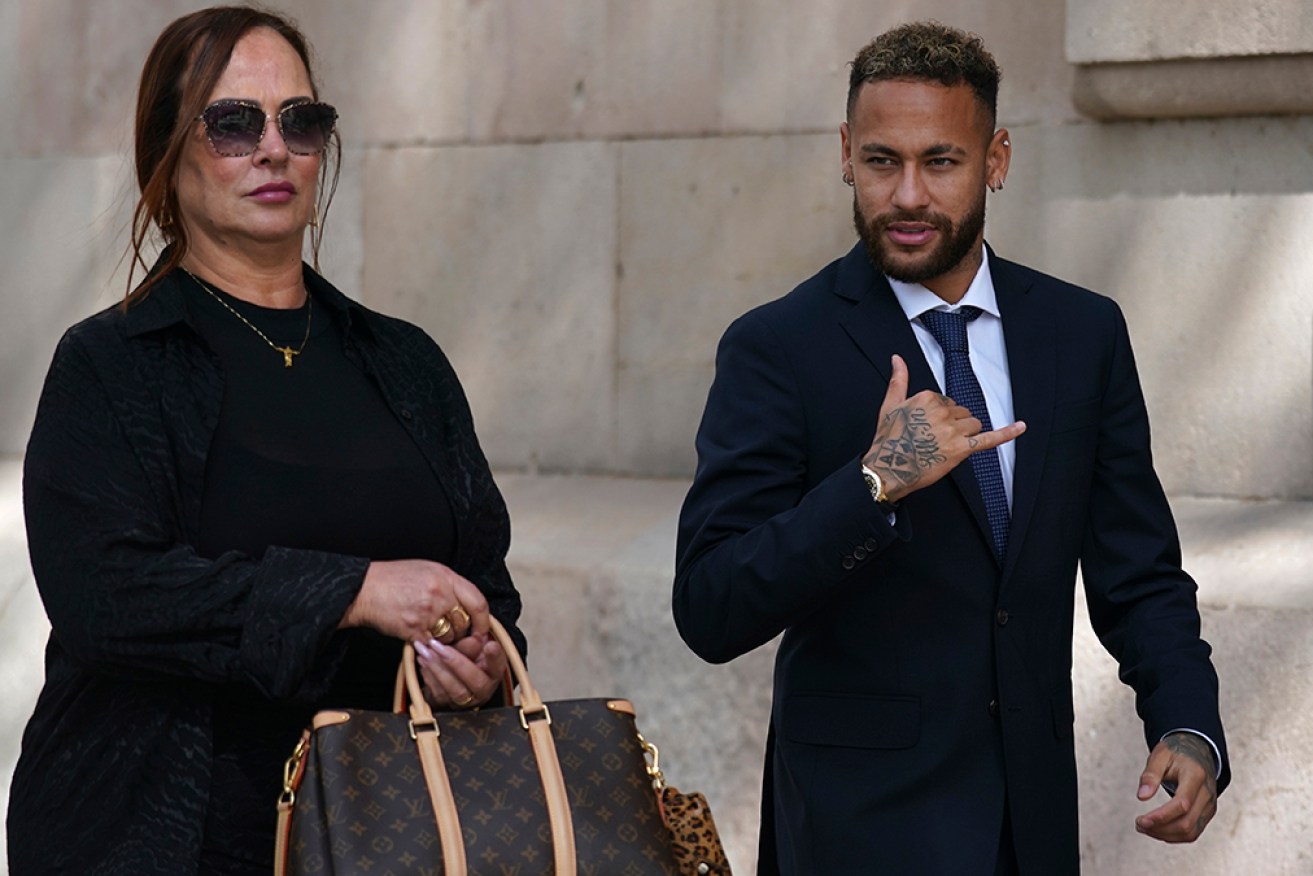 Neymar leaves court in Spain with his mother and fellow defendant Nadine Gonçalves da Silva Santos. 