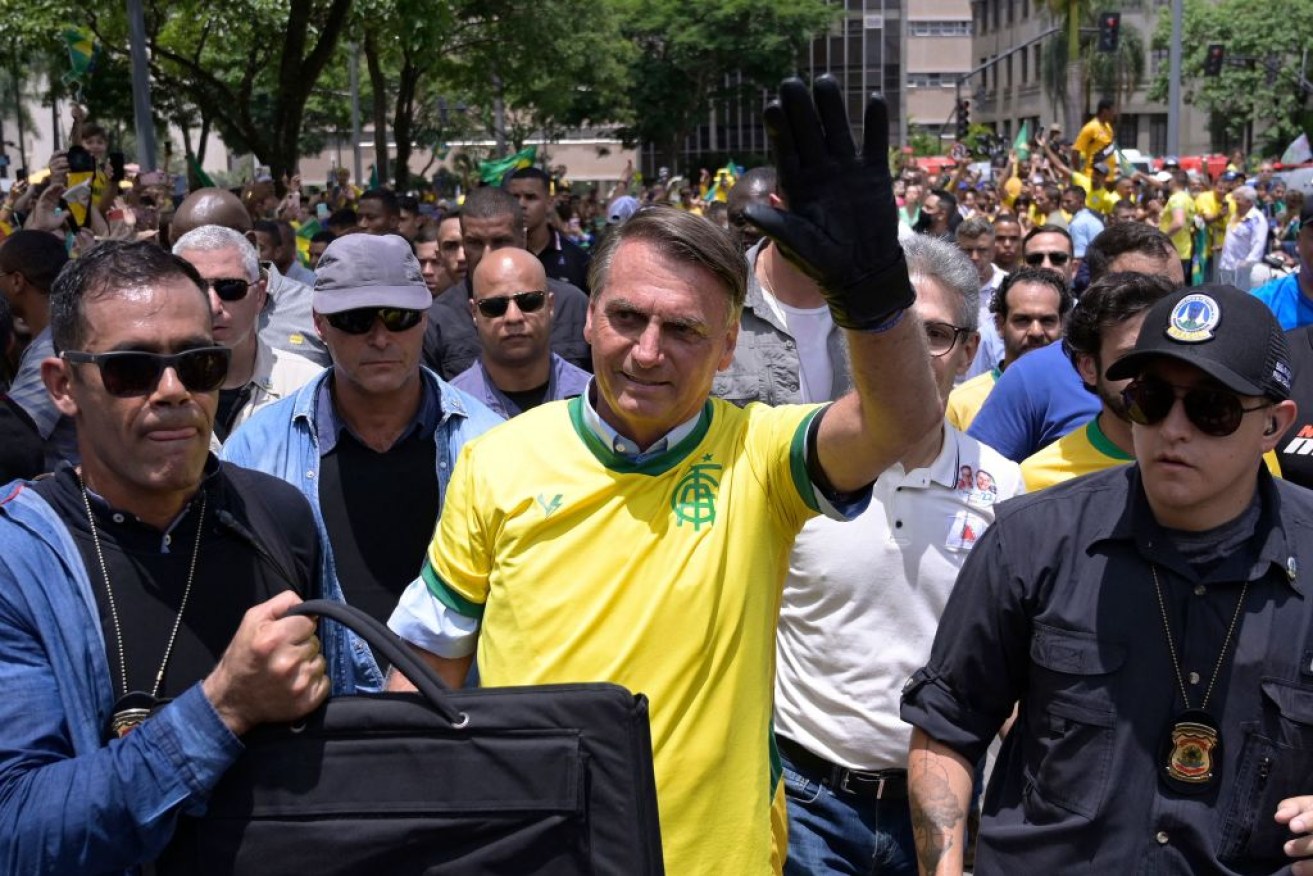 Jair Bolsonaro, pictured on the campaign trail,  is stoking his supporters' suspicions of a stolen election. <i>Photo: Getty</i>