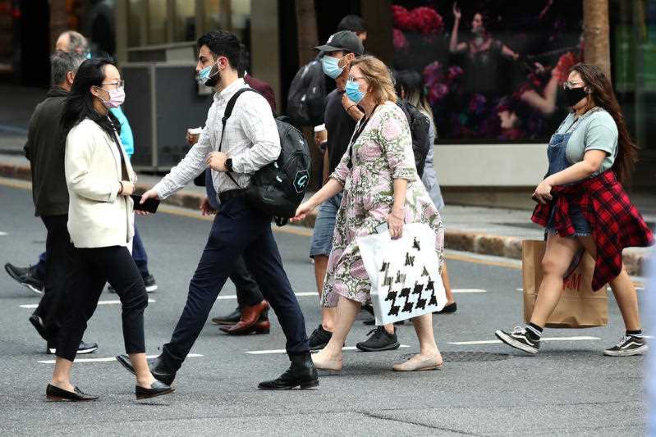 The Queensland government is urging masks for people on public transport and in crowded settings.