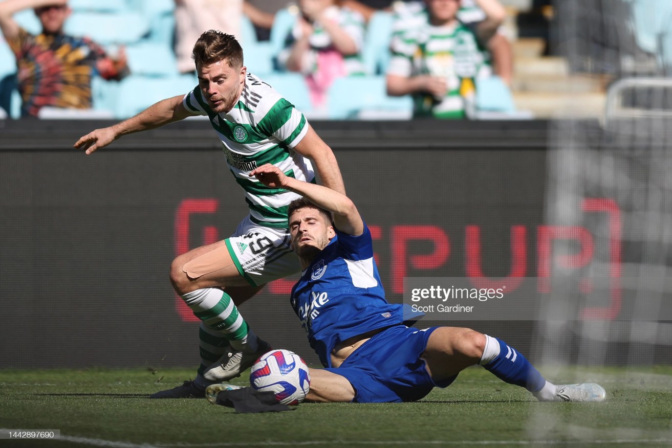 Celtic's James Forrest tussles with Vitaliy Mykolenko of Everton during their Sydney Super Cup clash in Sydney.