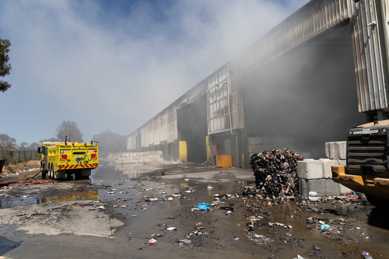 An ACT recycling centre is 'a write-off' after a fire expected to burn for days.