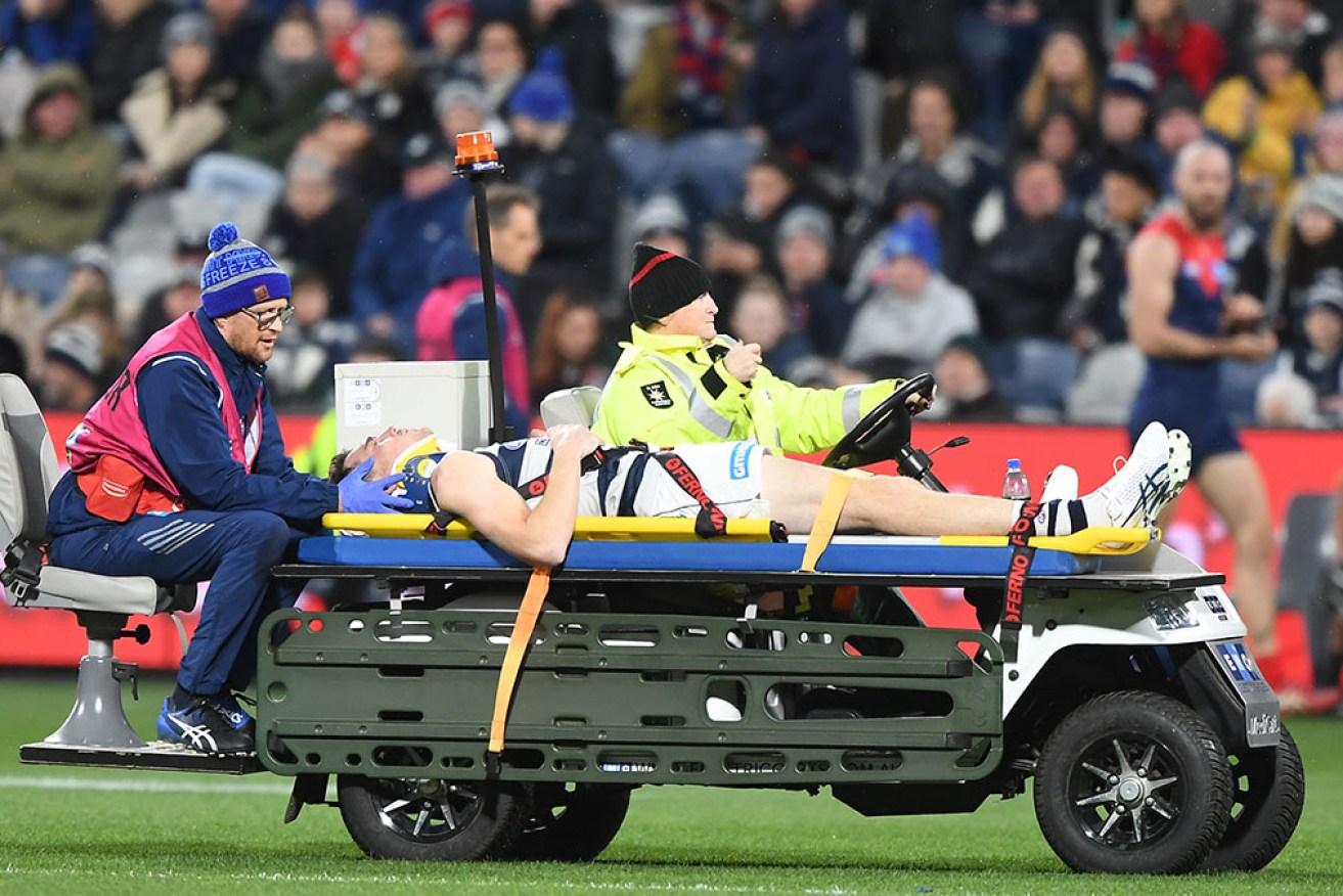 Geelong’s Jeremy Cameron was taken from the field on a stretcher early in the win over Melbourne.