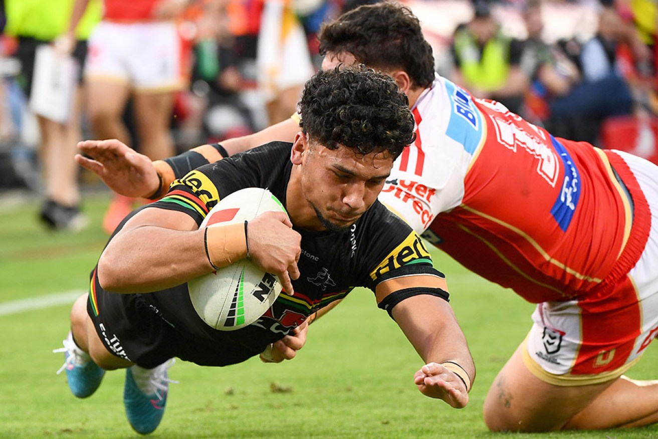 Penrith scored two late tries to deny the Dolphins in a 24-14 NRL win in Redcliffe on Sunday. 