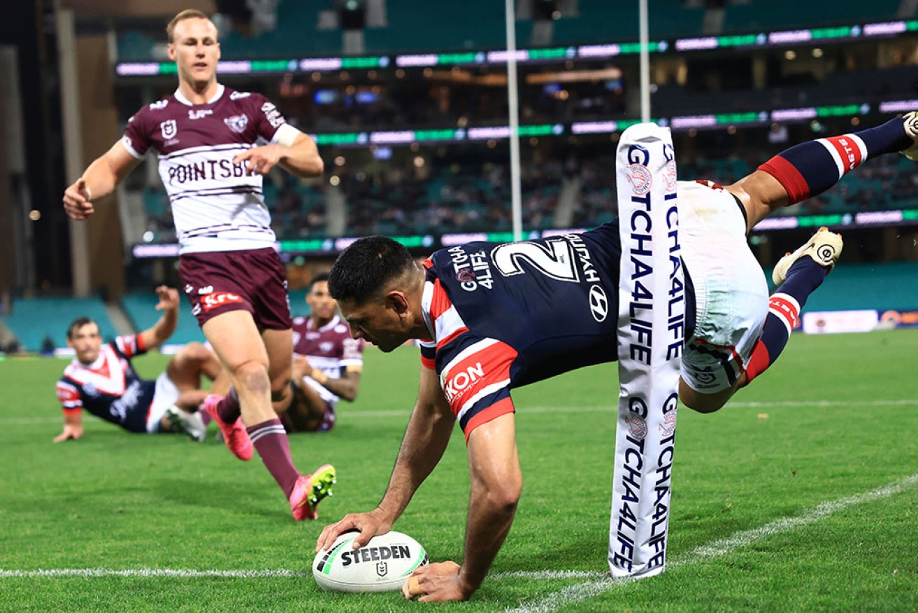 Winger Daniel Tupou has scored two tries in the Roosters' 26-16 NRL victory over Manly at the SCG.