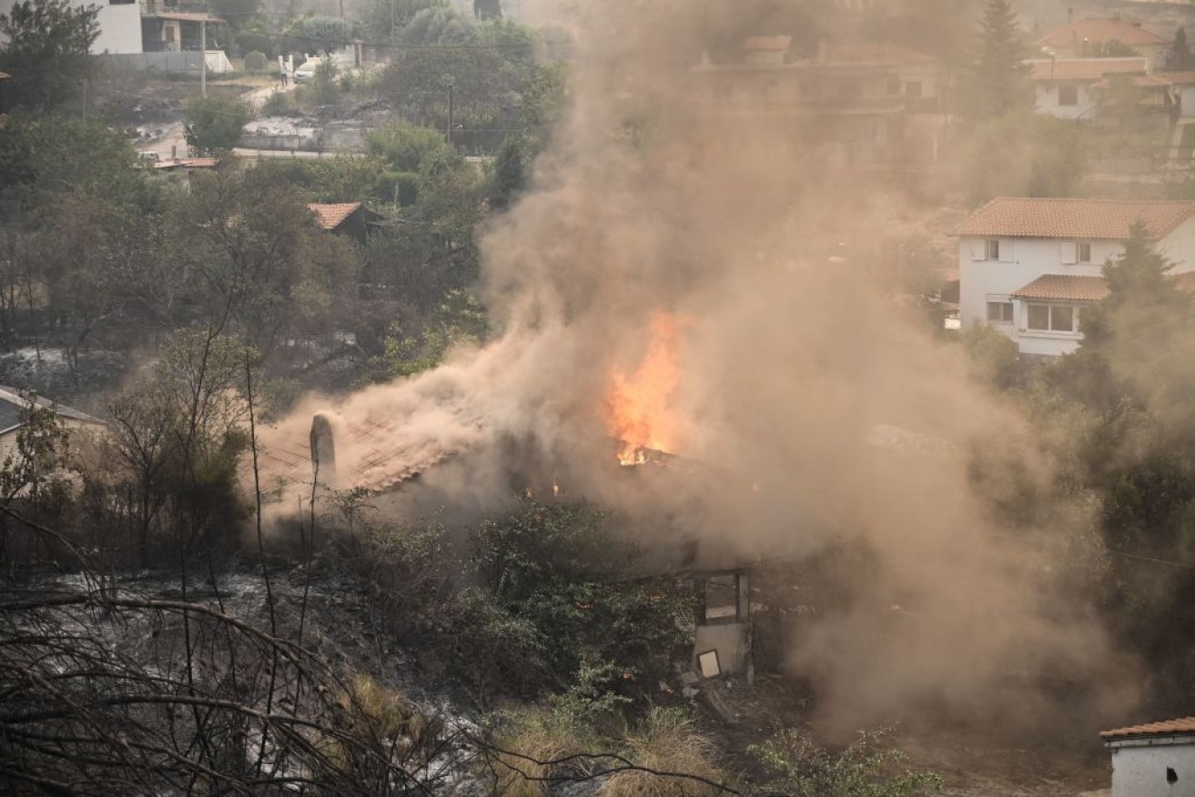 A house burns in Avantas, near Alexandroupoli, northern Greece. 