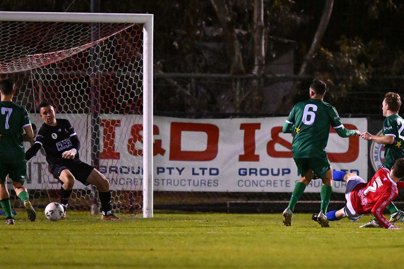 Melbourne Knights' Mitch Hore scores in the 2-0 win over Campbelltown City in the Australia Cup on Tuesday.