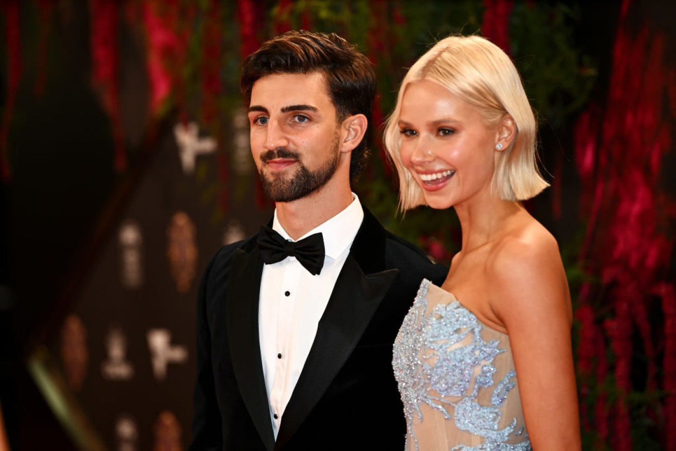Collingwood’s Josh Daicos plays second fiddle on the red carpet to Annalise Dalins.