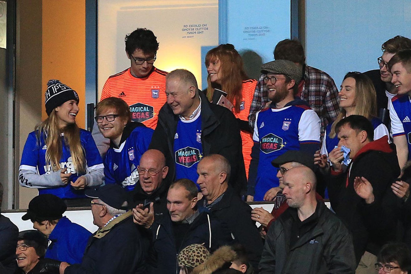 Ed Sheeran, pictured in 2018, celebrated Ipswich Town’s win by pulling pints for players and fans at the pub. 