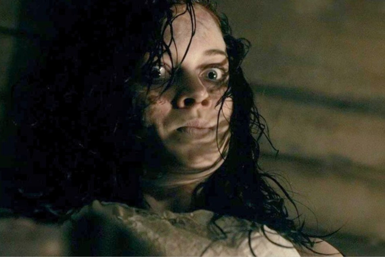 Jane Levy in a scene from <i>Evil Dead</i>, based on a fictional Sumerian book that summons evil.