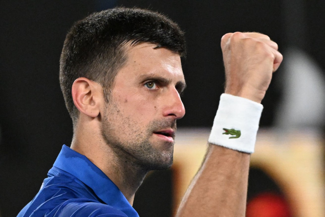 Novak Djokovic celebrates after victory against Tomas Etcheverry.