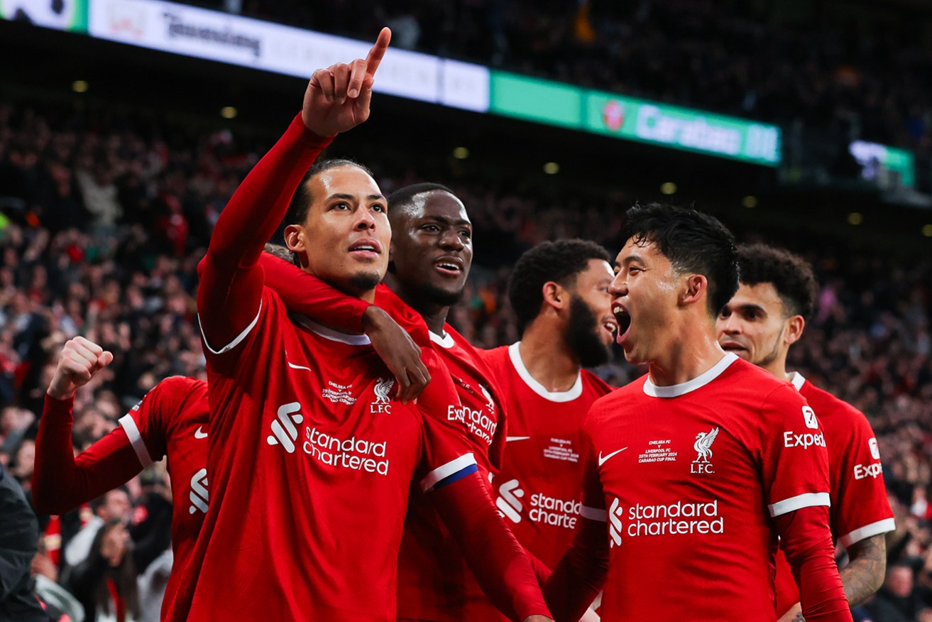 Liverpool skipper Virgil van Dijk celebrates with teammates, but his header was later cancelled by VAR.