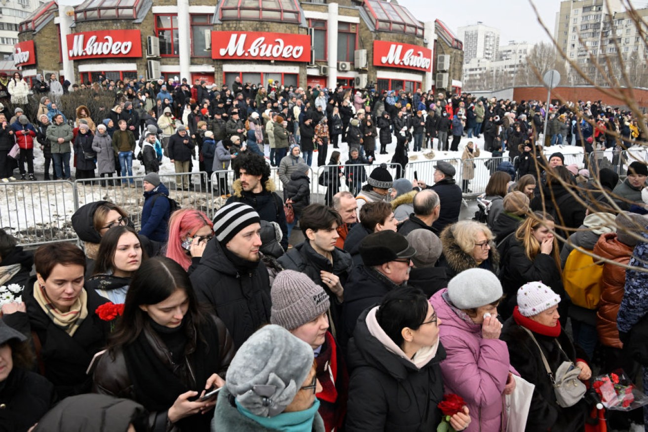 Mourners gather outside the church in Moscow where the funeral was held for Alexei Navalny. 