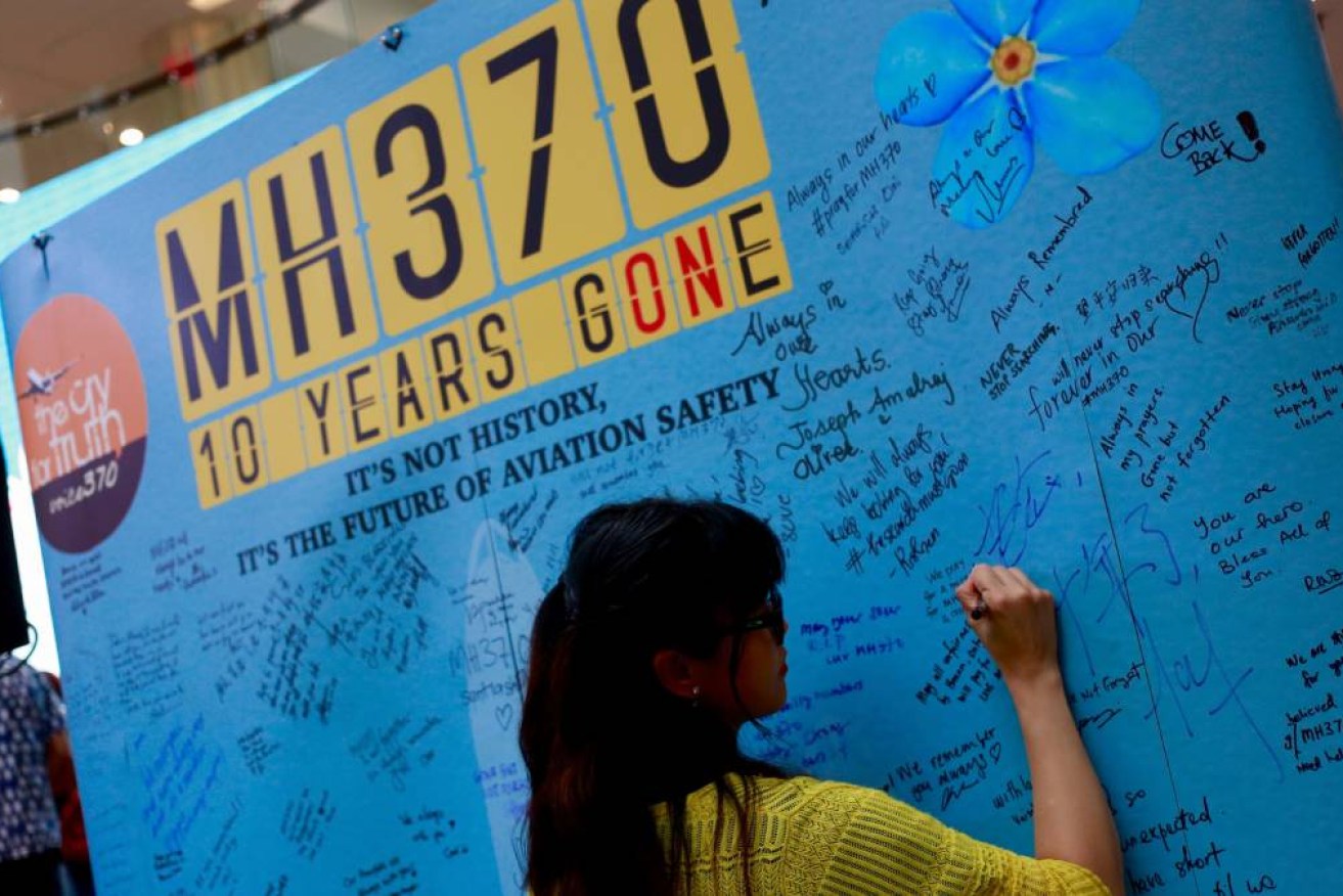 Relatives of passengers MH370 write messages at the Day of Remembrance in Petaling Jaya, Malaysia, on March 3, 2024.