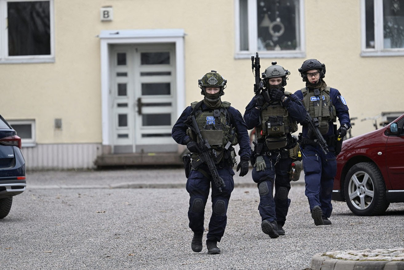 Finnish police investigate the scene at the Viertola comprehensive school where a child opened fire and injured three other children in Vantaa. 