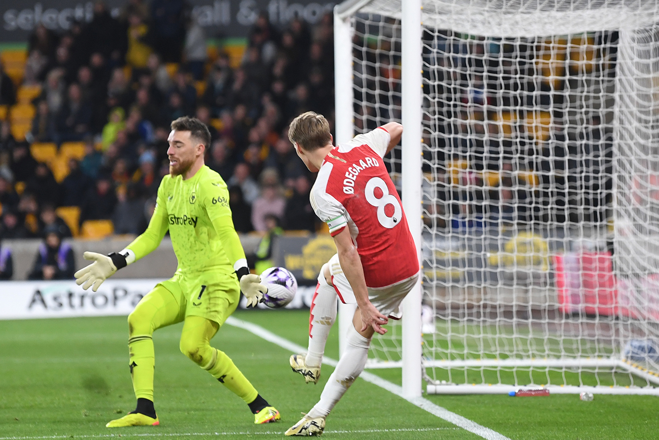 Martin Odegaard seals the win by shooting past Wolves goalkeeper Jose Sa on Sunday. 