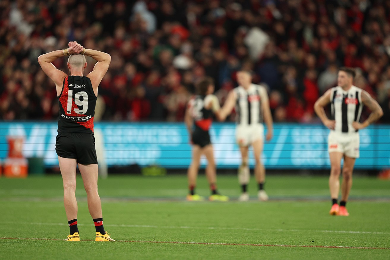 Essendon’s Nick Hind is in disbelief after the Anzac Day match against Collingwood ended in a draw. 