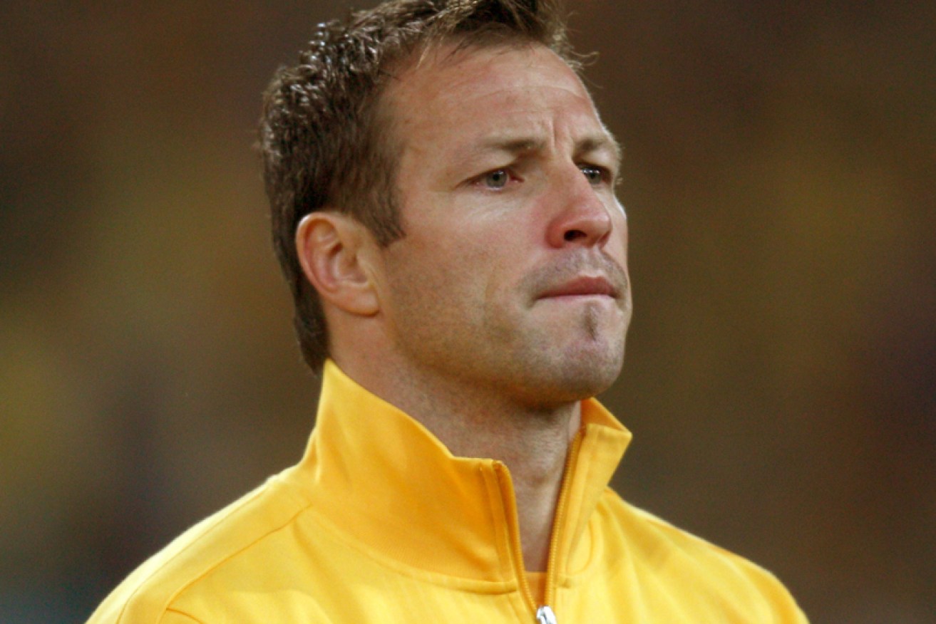 Socceroos captain Lucas Neill says he won't be quitting and plans to lead the team to the World Cup.