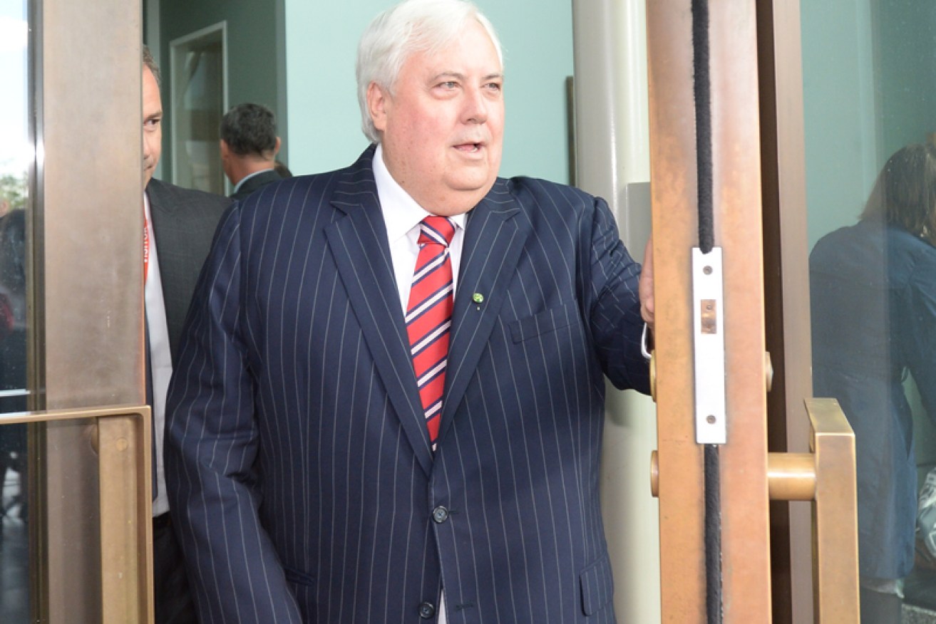 Clive Palmer declared himself a full-time politician as he arrived for his first day of parliament.
