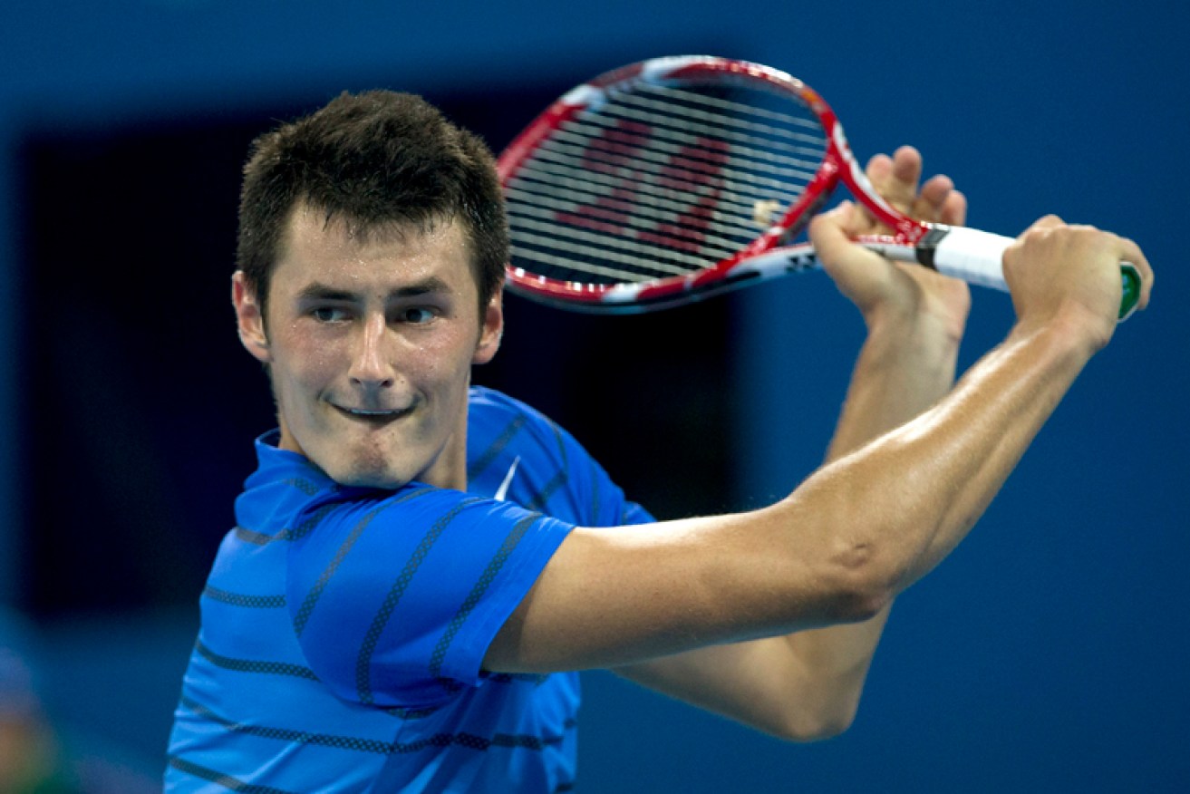 Bernard Tomic wants to ditch his party image and believes a humble approach will help him in 2014.
