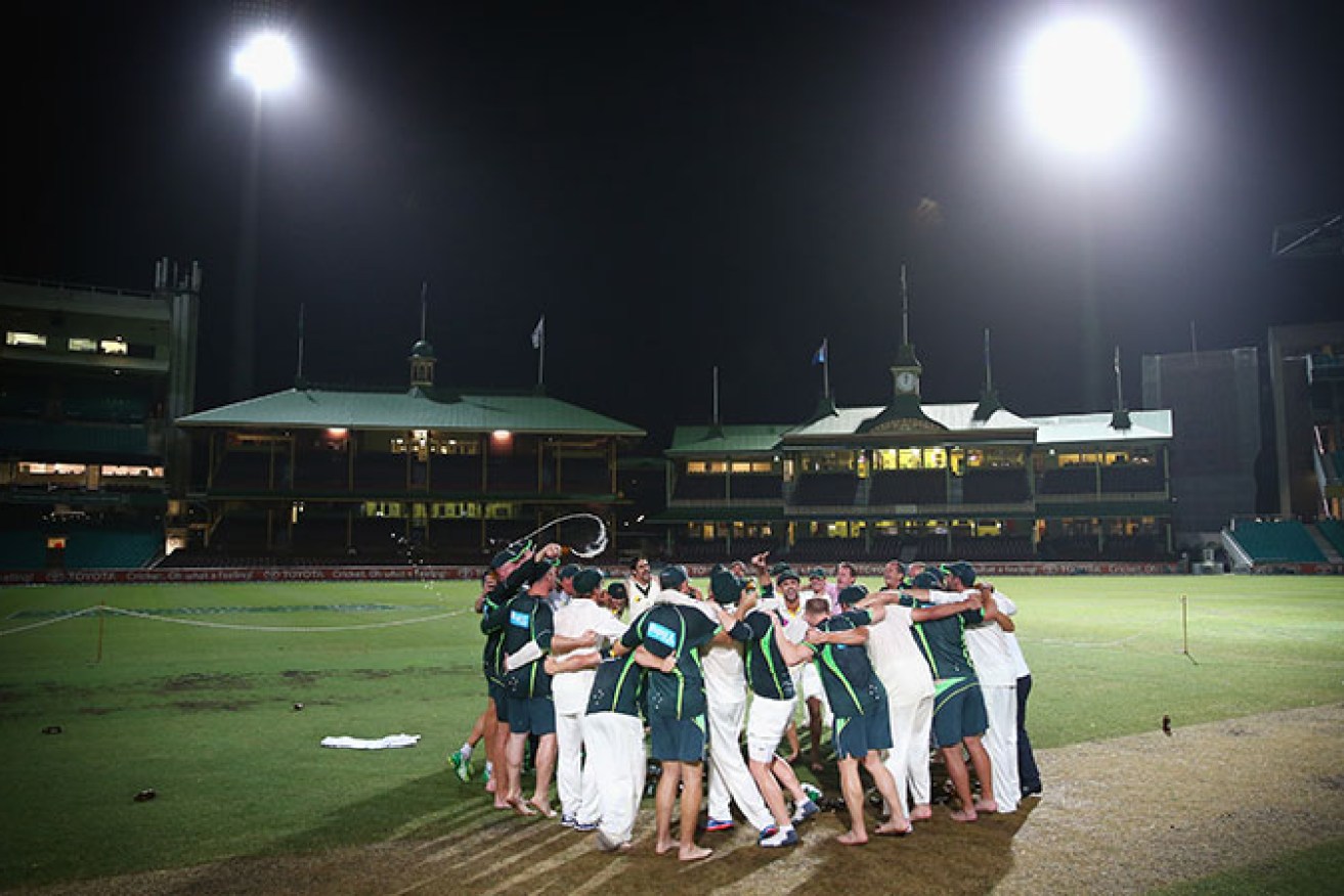 Nathan Lyon leads the team song for Australia on the SCG pitch at midnight after the home team's 5-0 series whitewash.