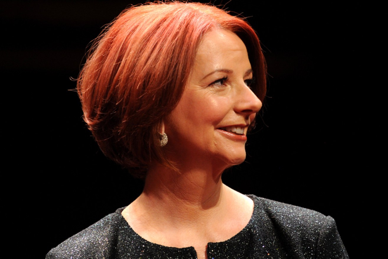 Julia Gillard has praised the Abbott government for maintaining funding to an education program.