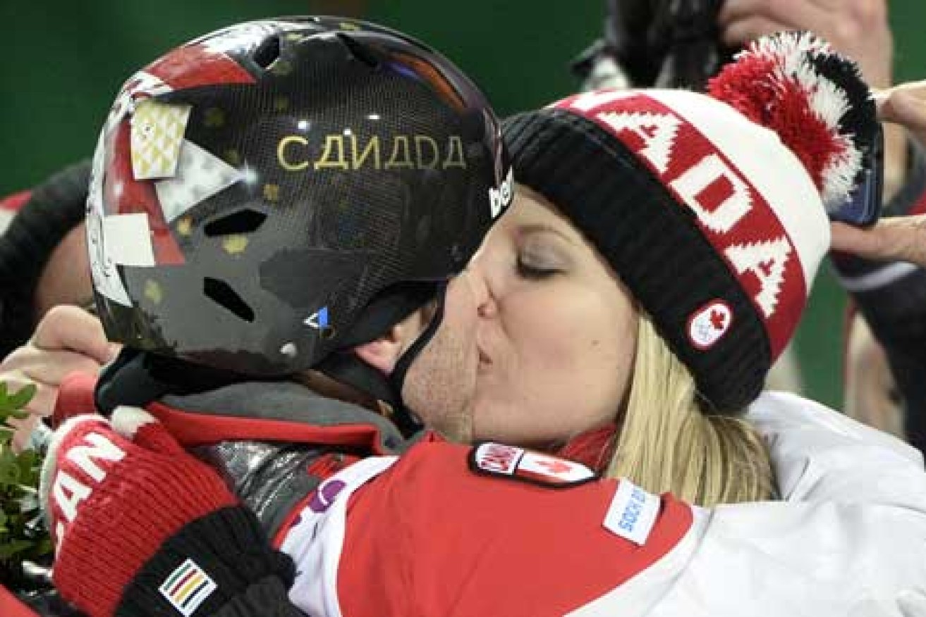 To the victor, the spoils: Alex Bilodeau and girlfriend Sabrina Bizier. Picture: Getty