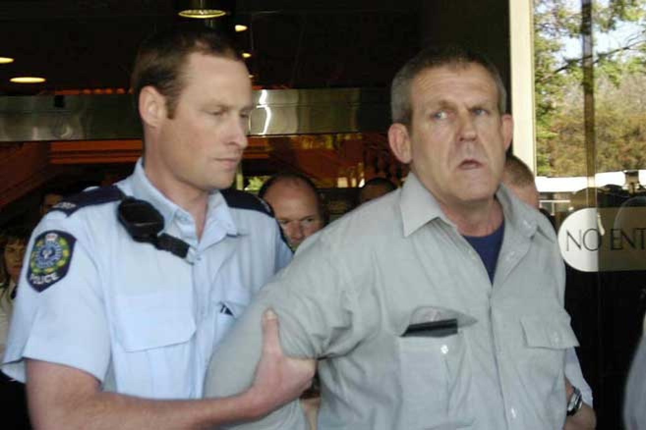 Bradley John Murdoch is escorted from court during his 2003 murder trial.