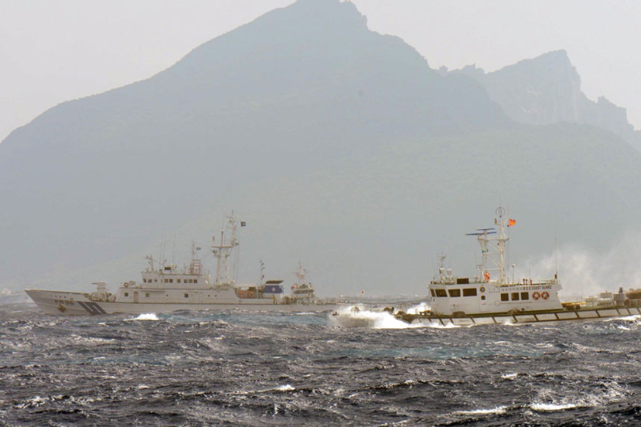 Japanese and Chinese naval vessels shadow each other off the Sankaku Islands in 2014. Getty Images