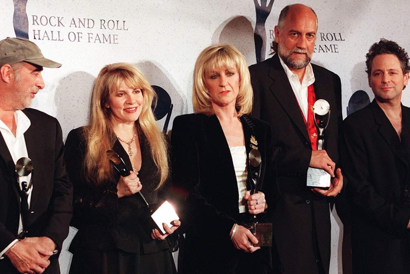 They look like the best of friends, but tensions with Lindsey Buckingham (far right)  saw the veteran guitarist axed.