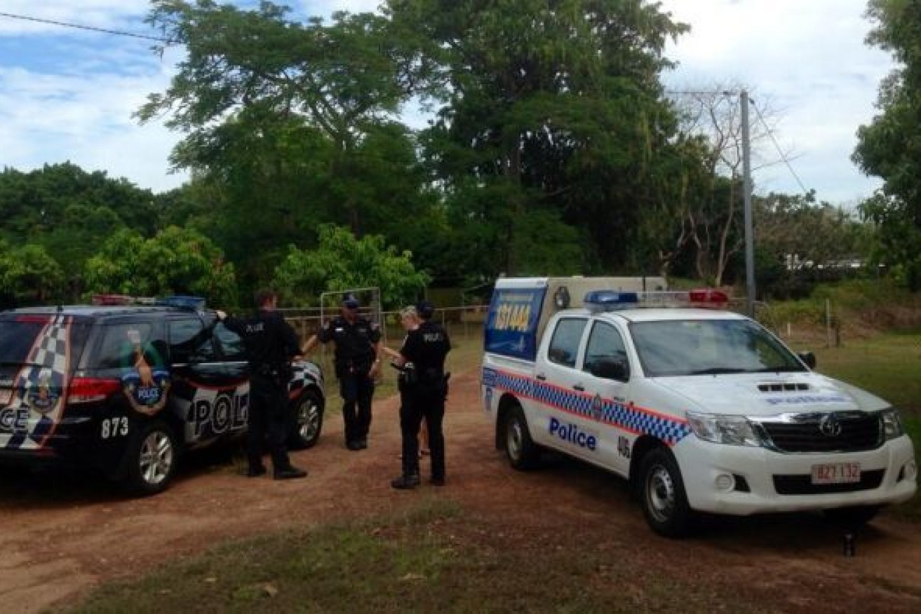 Police attend a property near Darwin where a mother and two children were found dead.