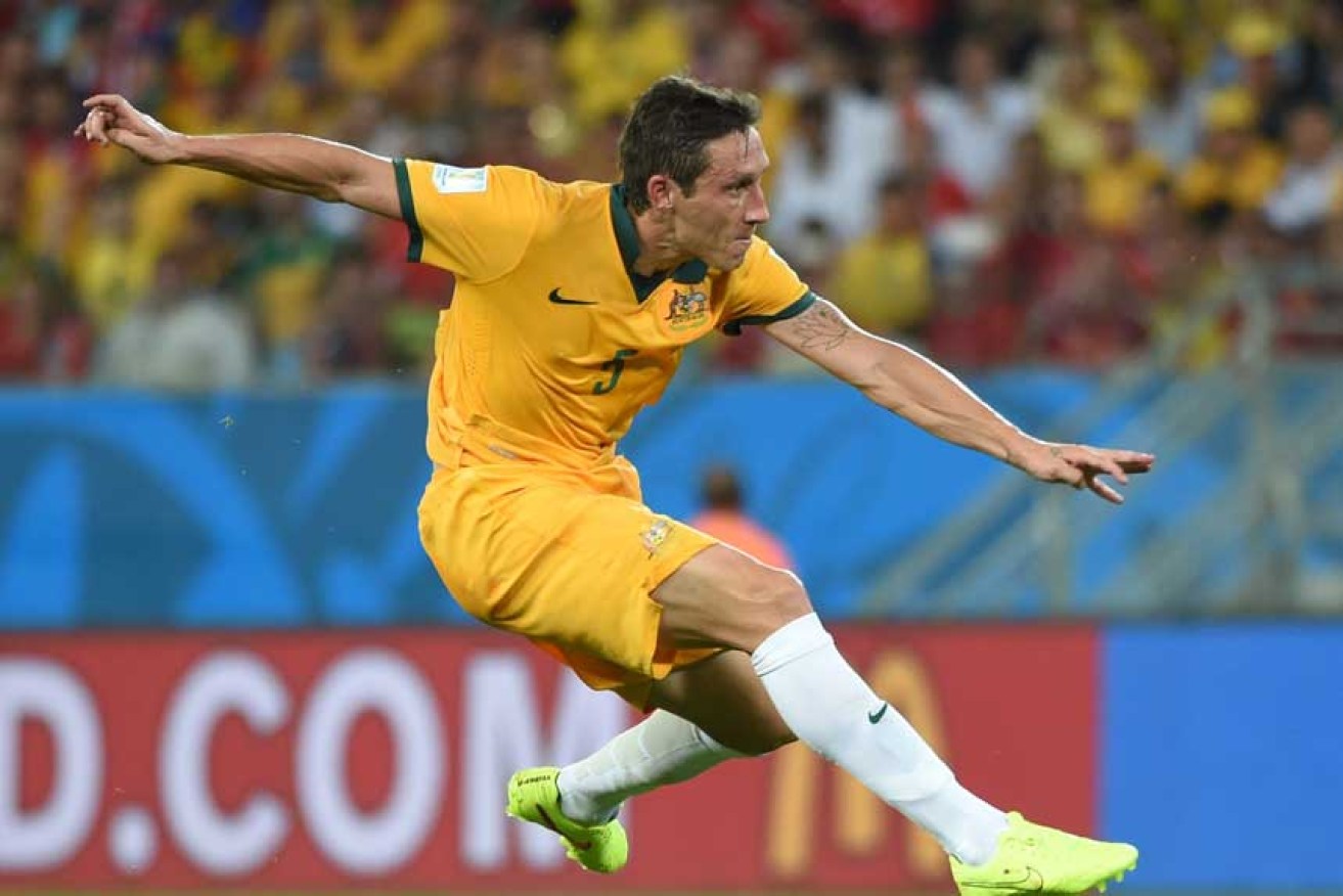Mark Milligan sends one into the net during his glory days as Socceroos skipper. <i>Photo: Getty</i>