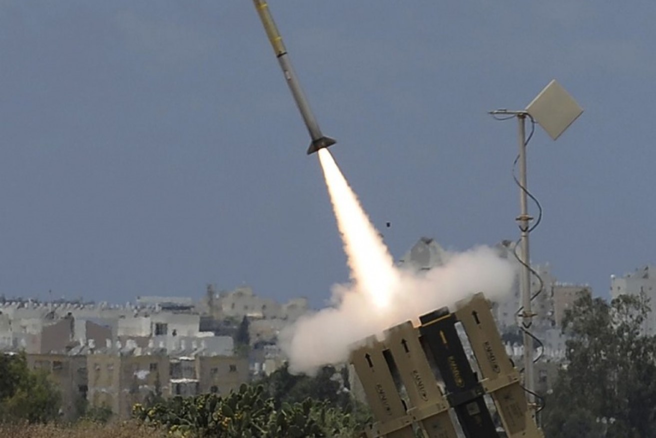 A missile is launched by an "Iron Dome" battery, a short-range missile defence system designed to intercept and destroy incoming short-range rockets and artillery shells, on July 14, 2014 in the southern Israeli city of Ashdod. United Nations chief Ban Ki-moon called on Israel to scrap plans for a ground offensive, saying "too many" Palestinian civilians had been killed as the death toll from its punishing air campaign hit 172, with another 1,230 wounded. AFP PHOTO / DAVID BUIMOVITCH