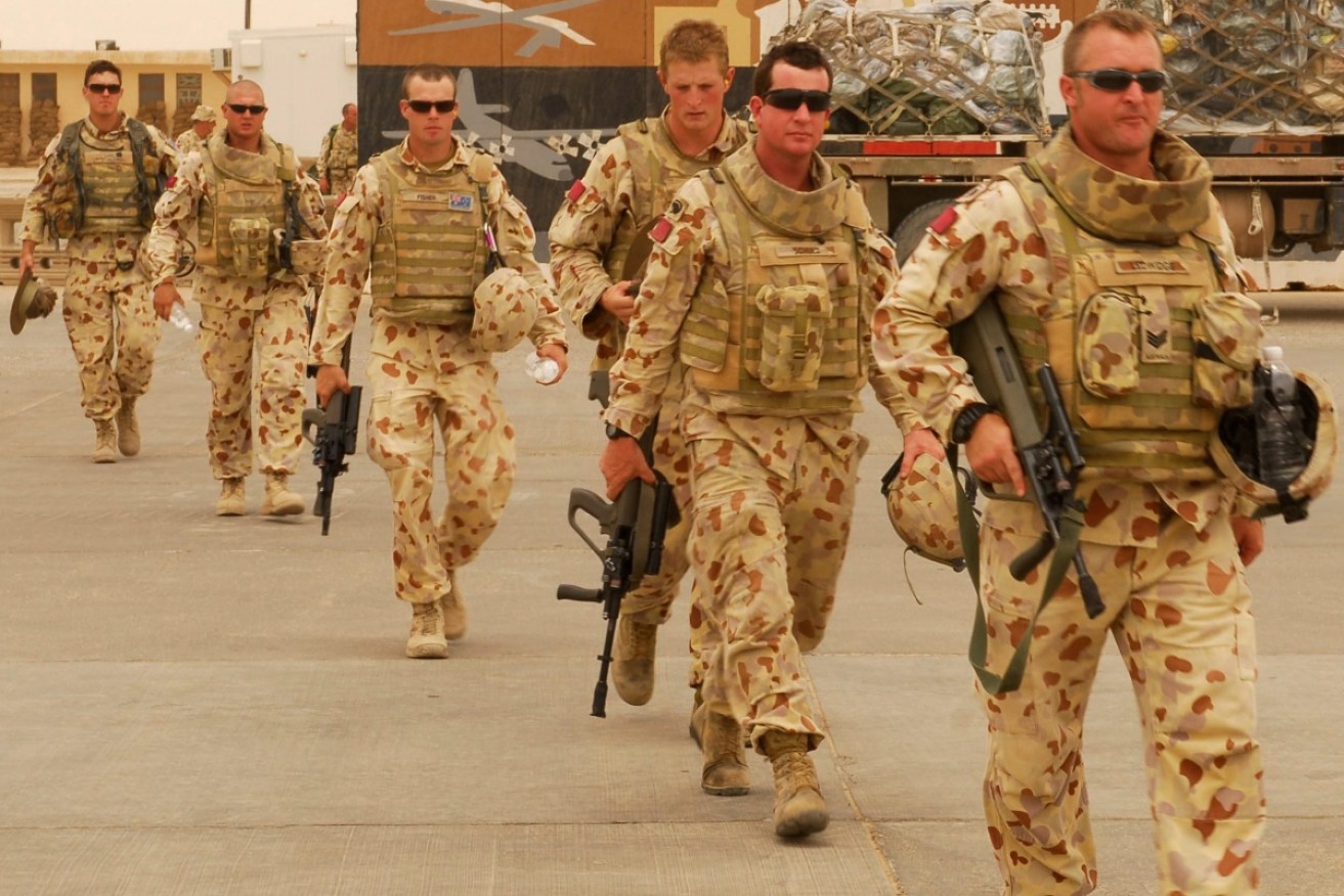 Their tour done, Australian soldiers in Iraq head home as a replacement contingent arrives.