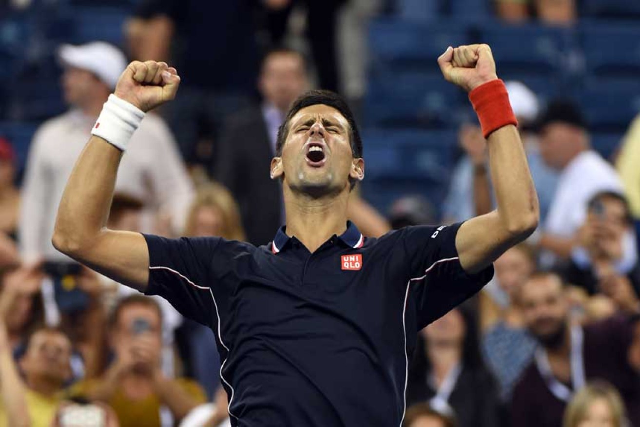 Djokovic reacts after beating Andy Murray.