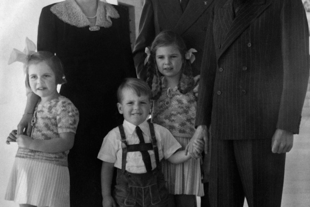 Goebbels (far right) poses with his wife, Magda, their three children and Adolf Hitler.