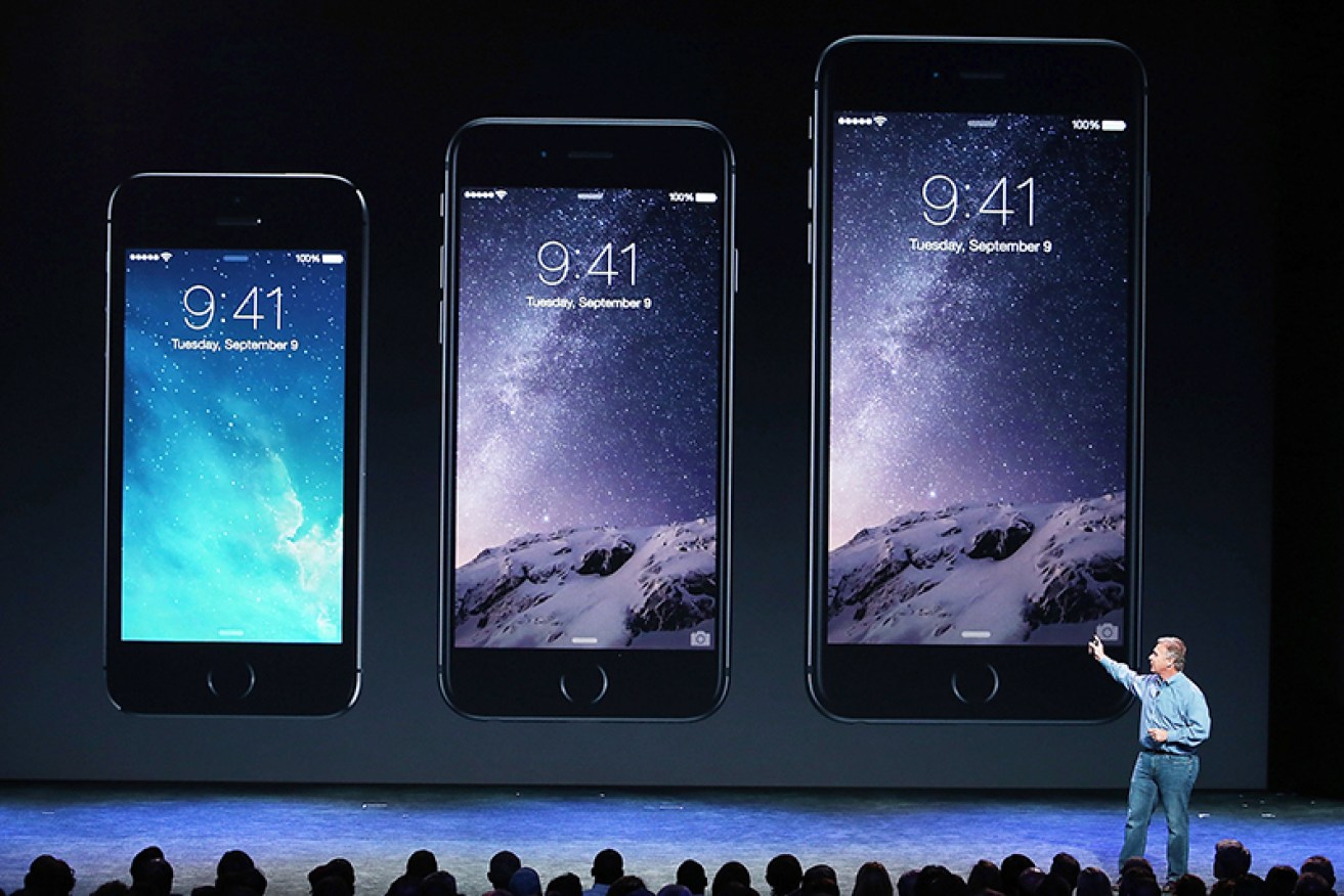 Apple's Phil Schiller shows off the next generation iPhone 6.