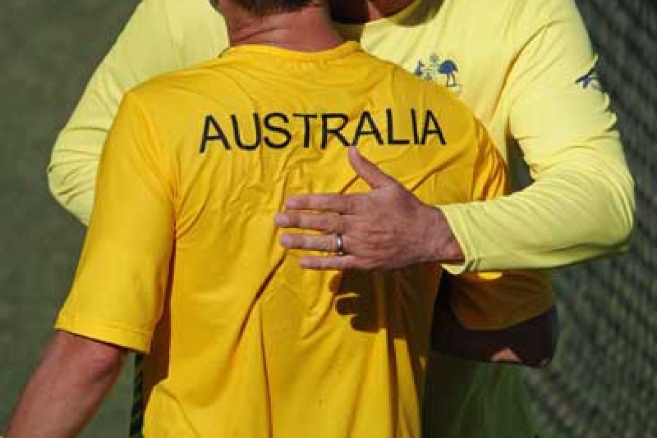 Pat Rafter and Lleyton Hewitt after Australia won their way back into the Davis Cup World Group. Photo: Getty