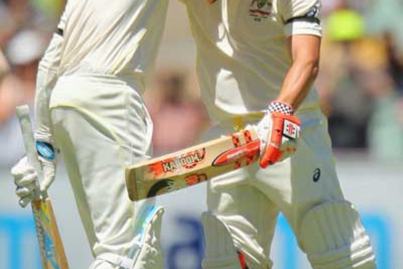 Michael Clarke and Warner shared a long embrace after the latter brought up his ton. Photo: Getty