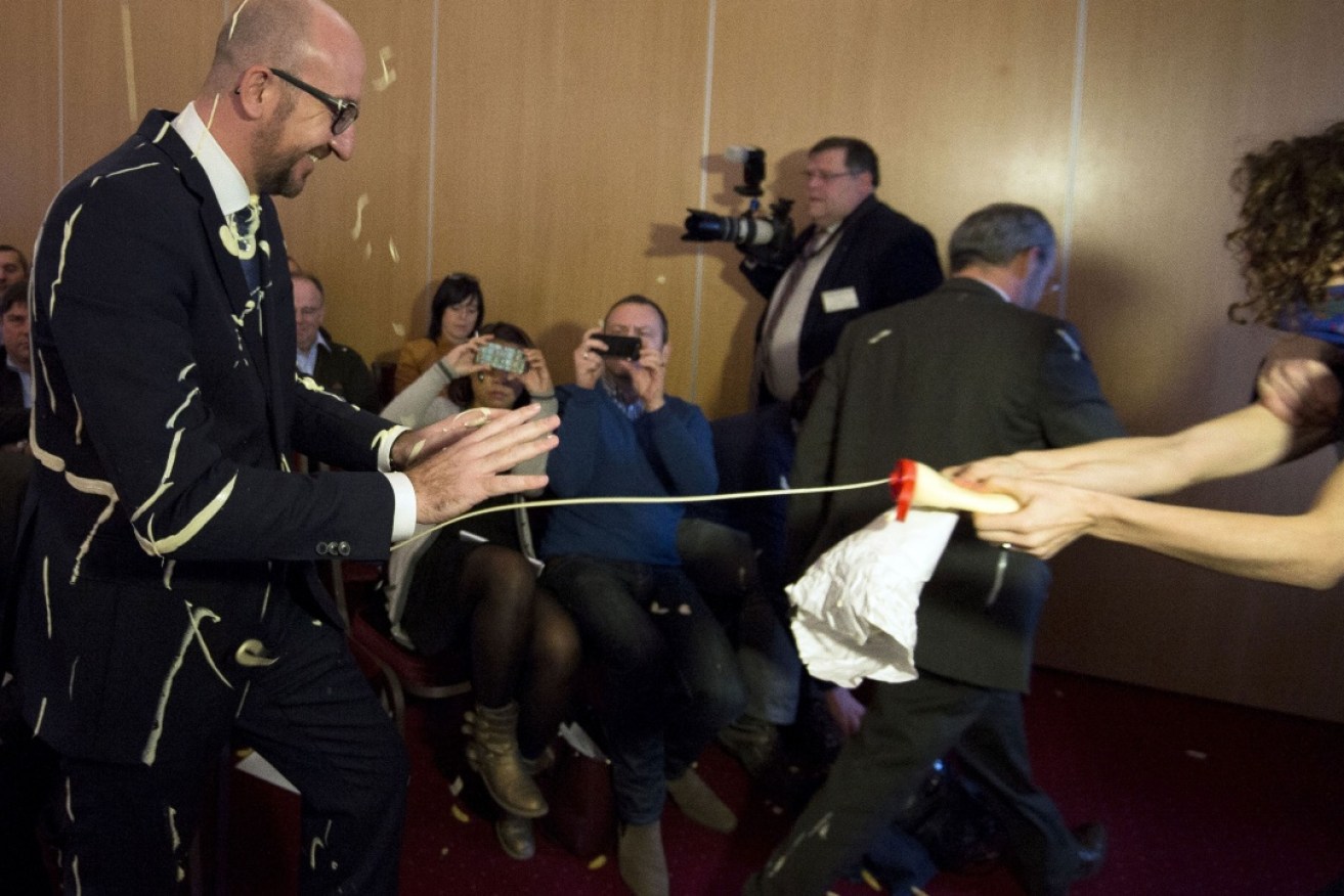 Charles Michel has a mayonnaise shower. Photo: Getty