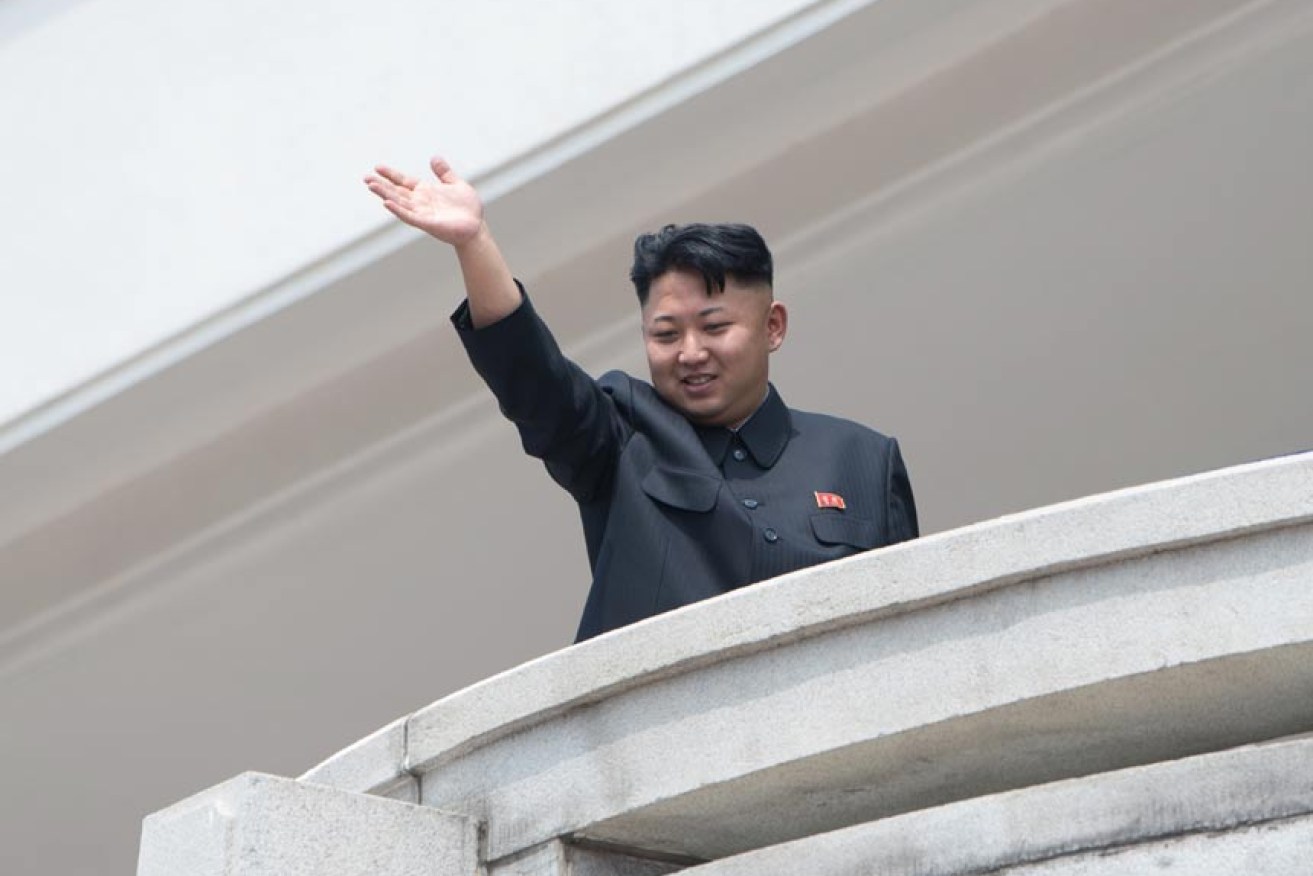 The supreme leader waves to his fans. Photo: AAP