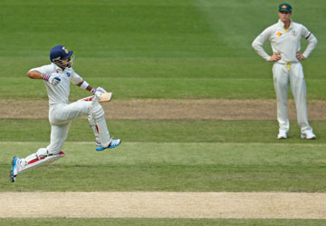... before posting his century, much to the joy of Australian captain Steven Smith. Photos: Getty