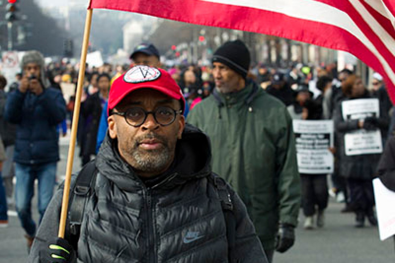 Film director Spike Lee, and others, march on Pennsylvania Avenue in Washington. Photo: AAP