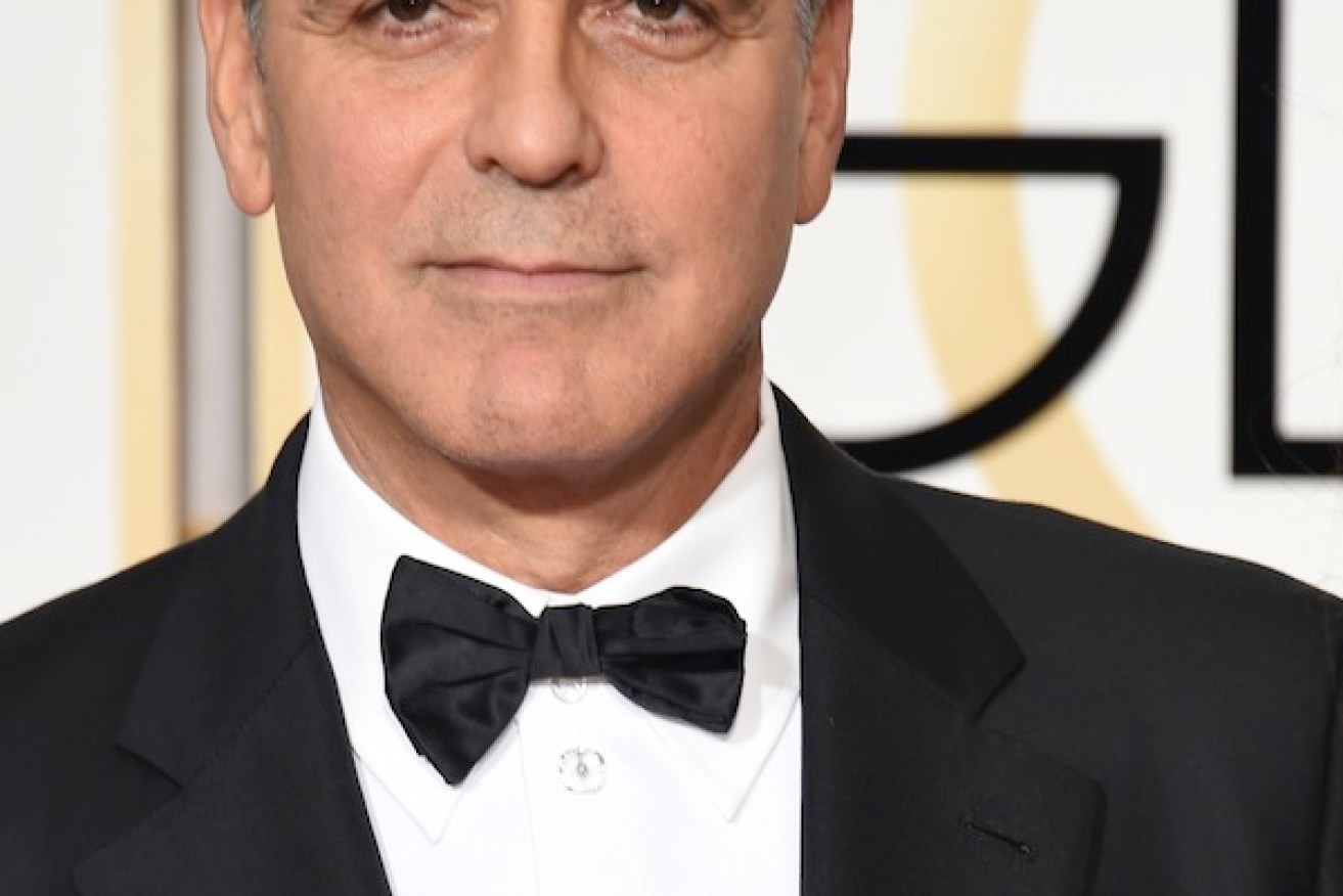Actor George Clooney wears a "Je suis Charlie" button.