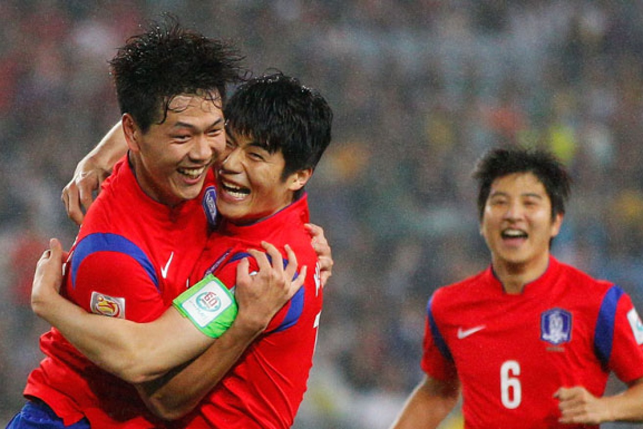 Kim Young Gwon and Ki Sung Yueng celebrate a goal against Iraq. Photo: Getty
