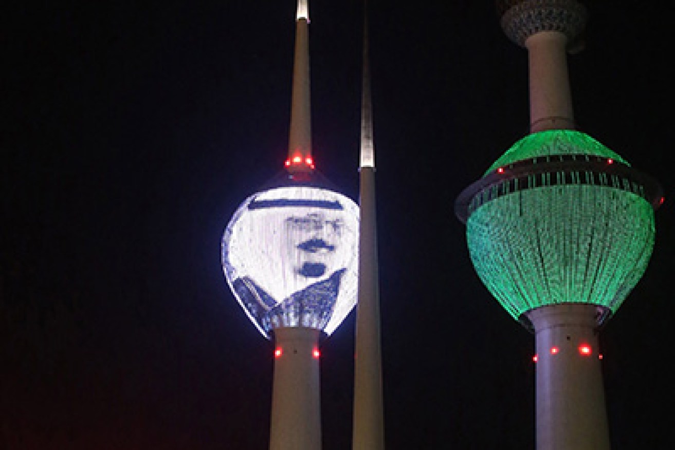 The Kuwait Towers in Kuwait City, are lit up with the portrait of Saudi Arabia's late King Abdullah. Photo: AFP
