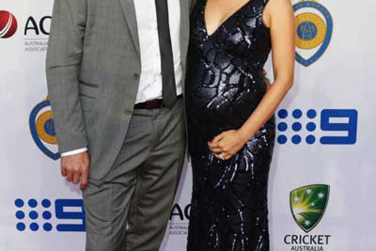 The 'tradie' suits up: Harris with wife Cherie. Photo: Getty