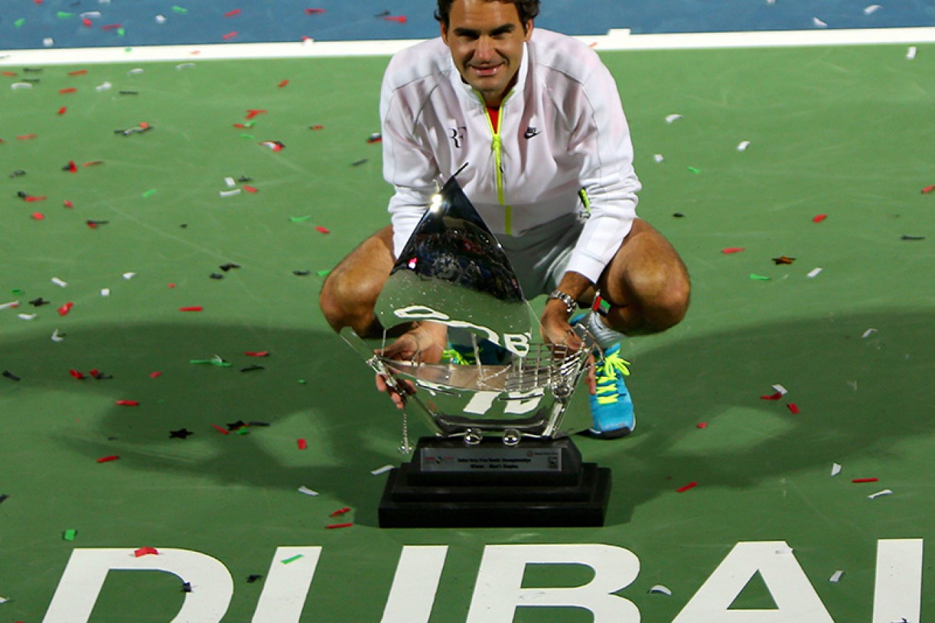 Still got it ,.. Roger Federer with the Dubai trophy. 